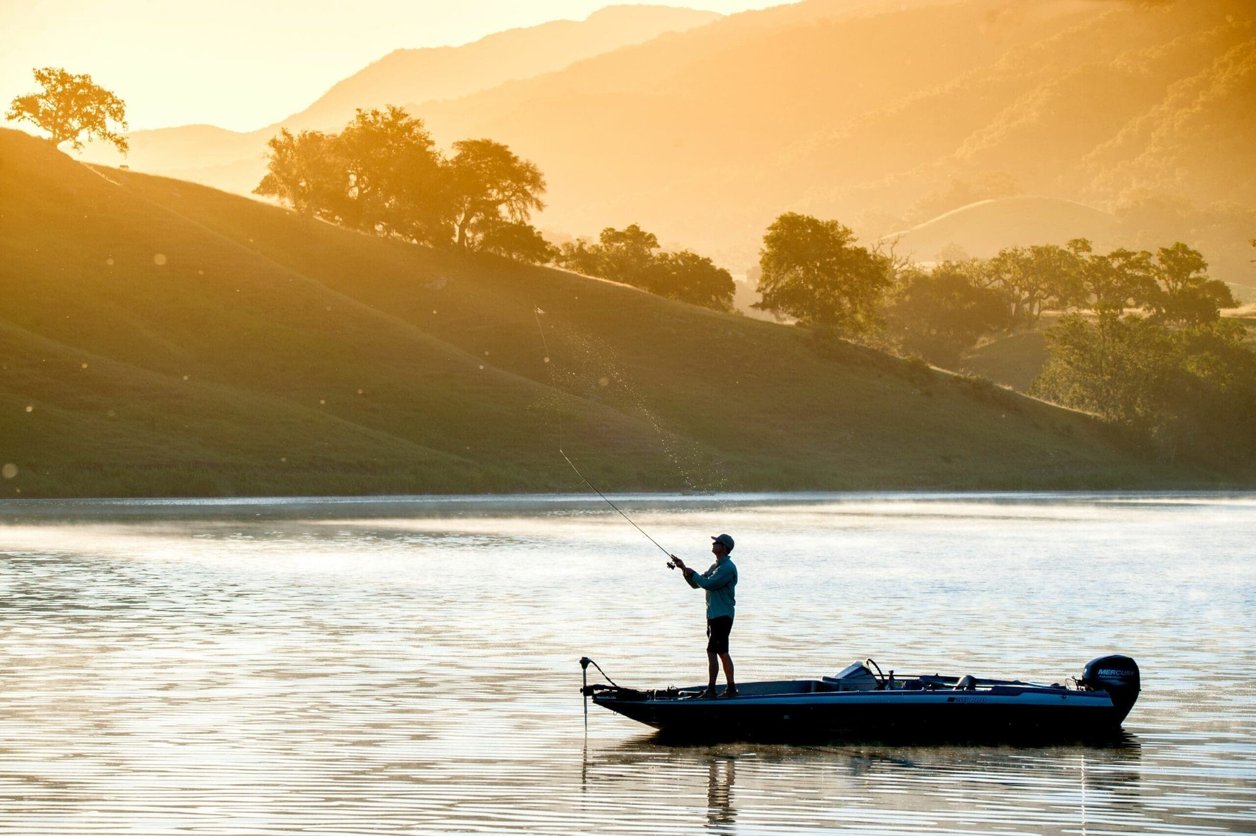 view of person fishing from boat on a lake