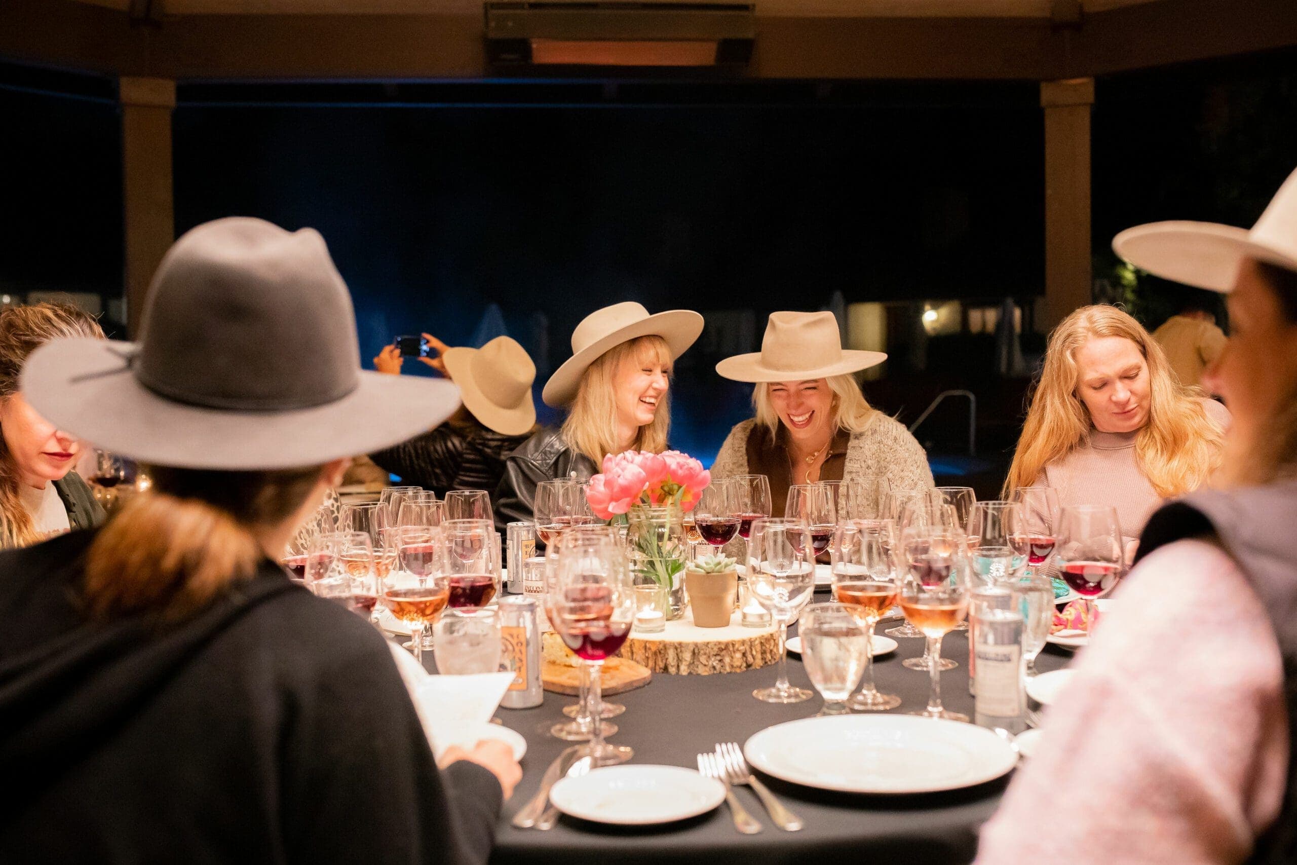 group of people sitting at a round table