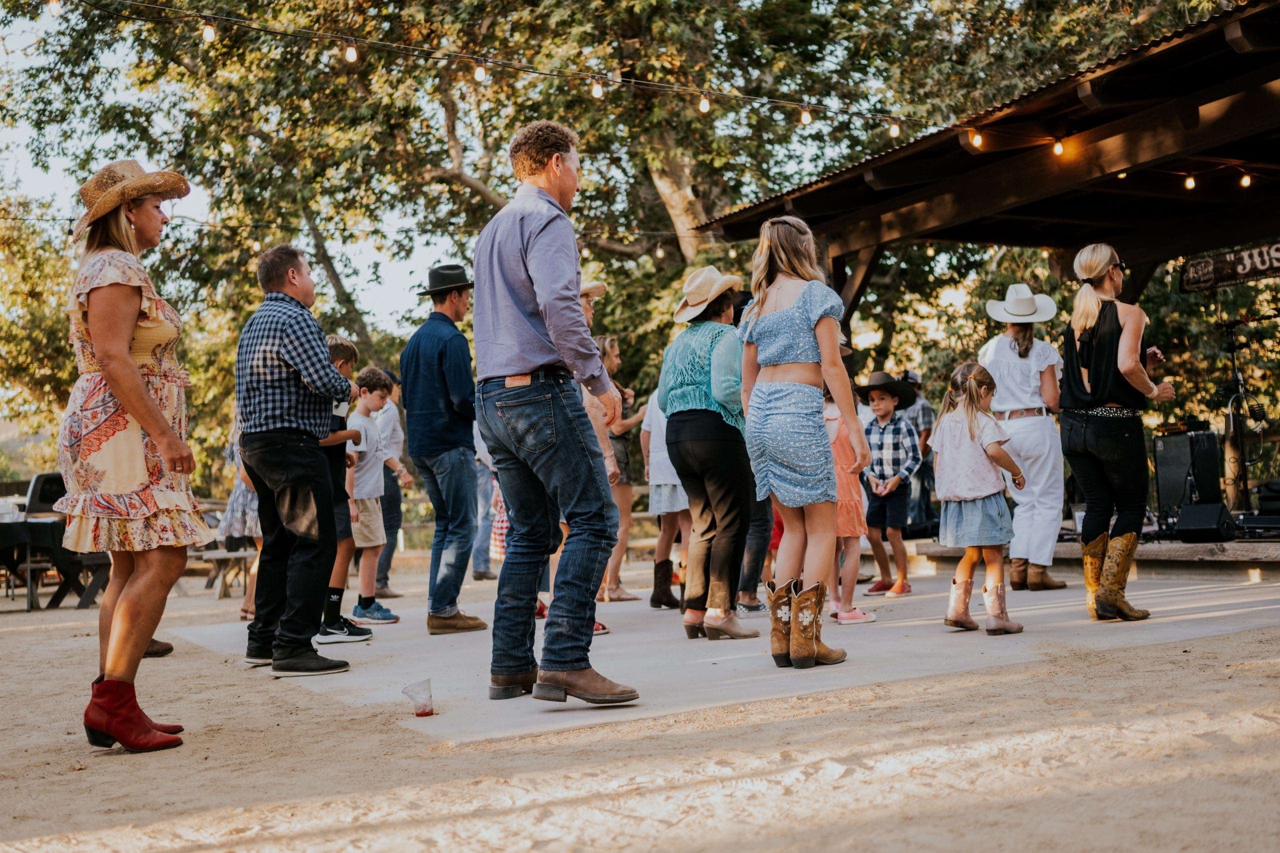 people line dancing outside