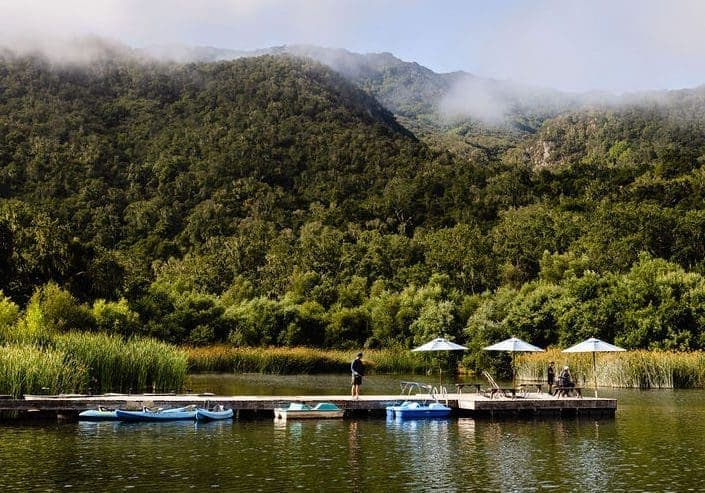Boats next to the dock on a lake at Alisal Ranch