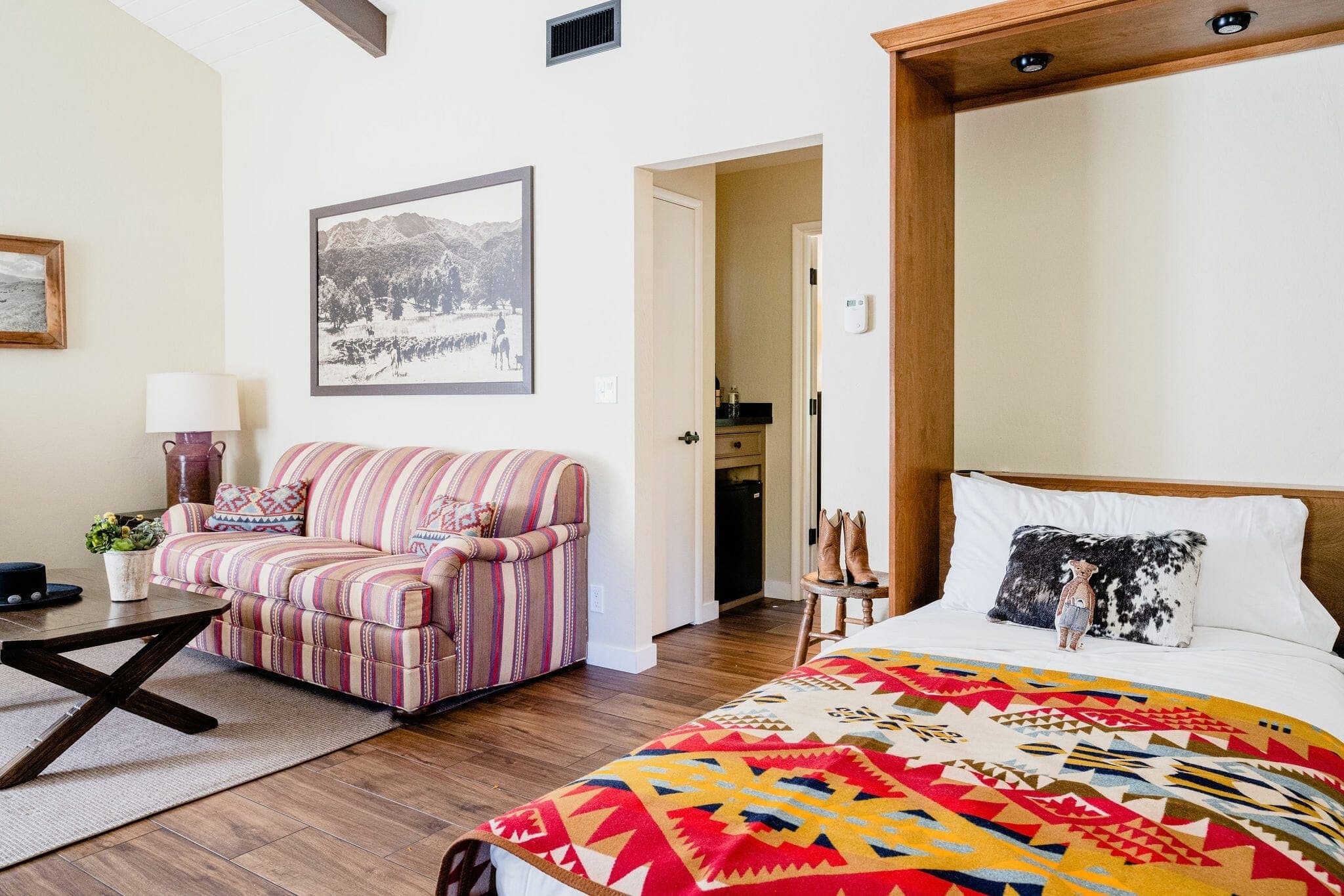 armour that turns into a bed beside a couch inside the superior cottage