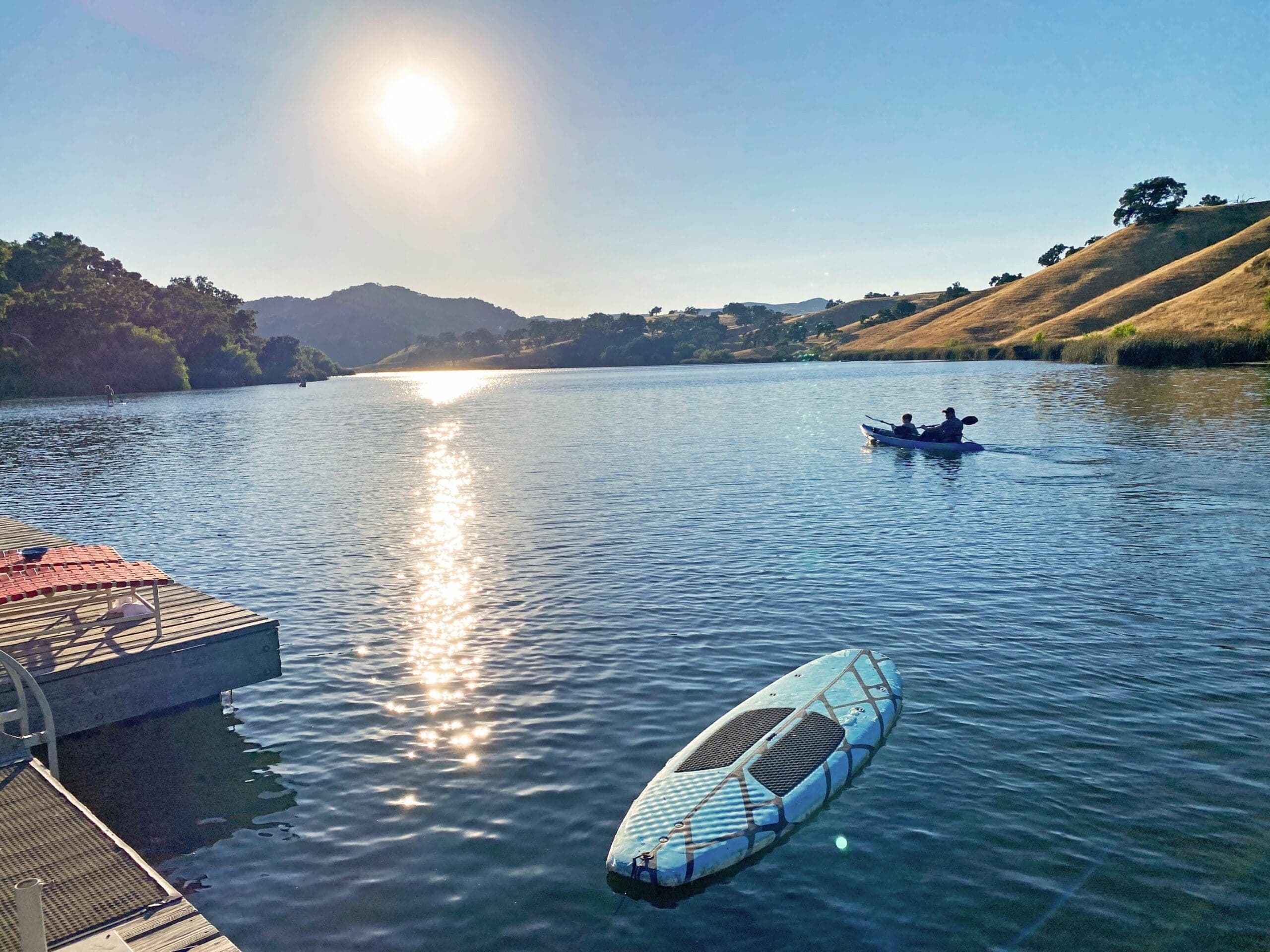 people canoeing on Alisal lake beside the docks