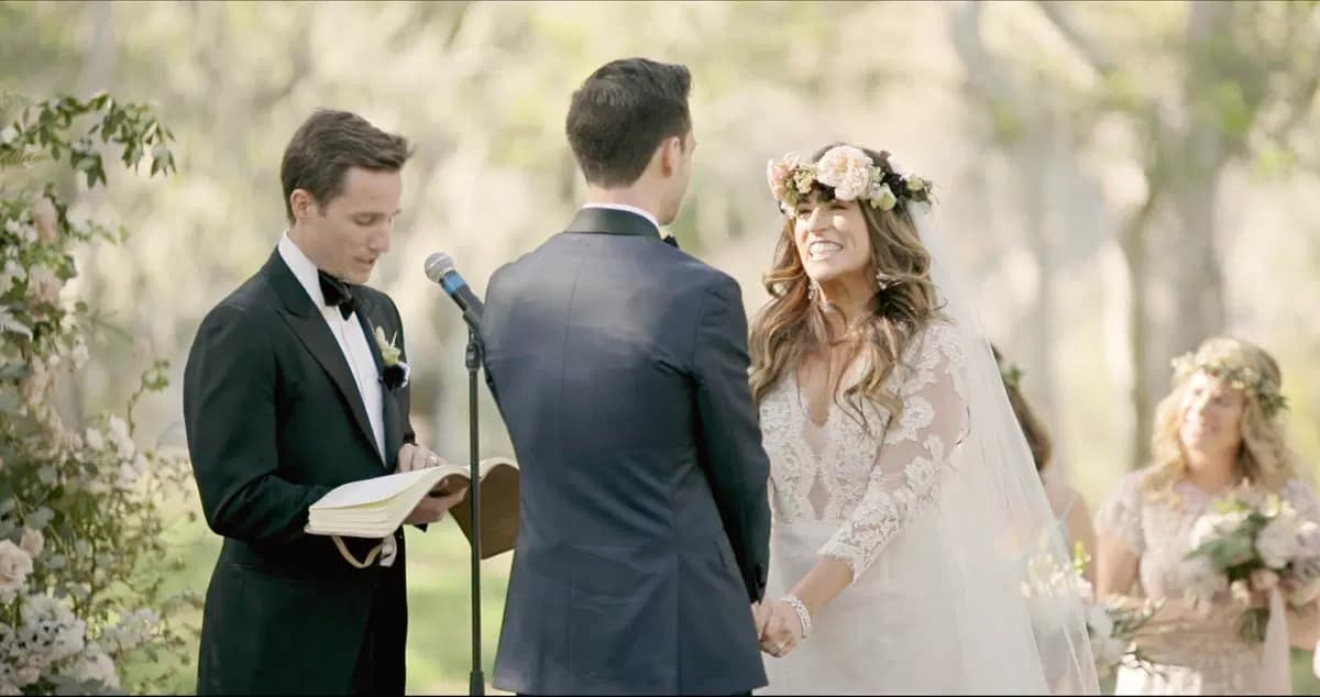 Couple getting married by a man in a suit at ALisal Ranch