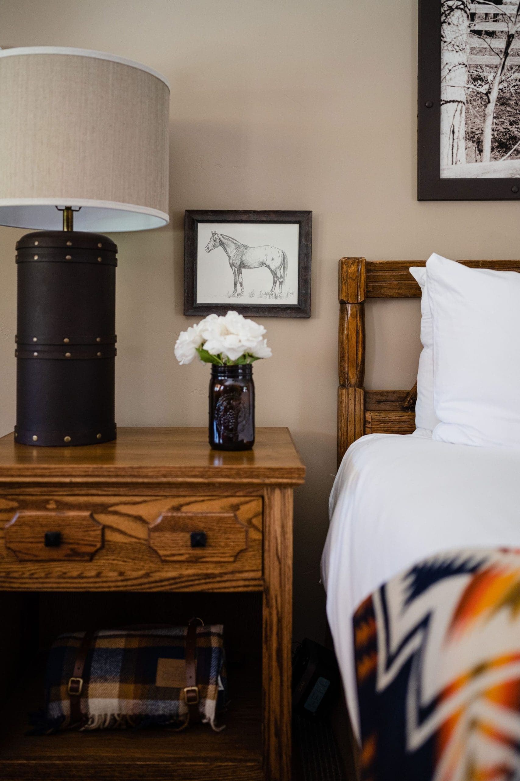 bedside table with flowers in a vase