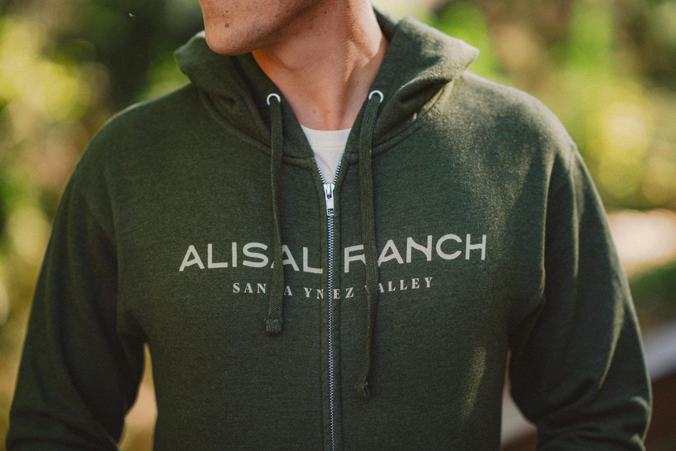 person wearing alisal ranch sweater