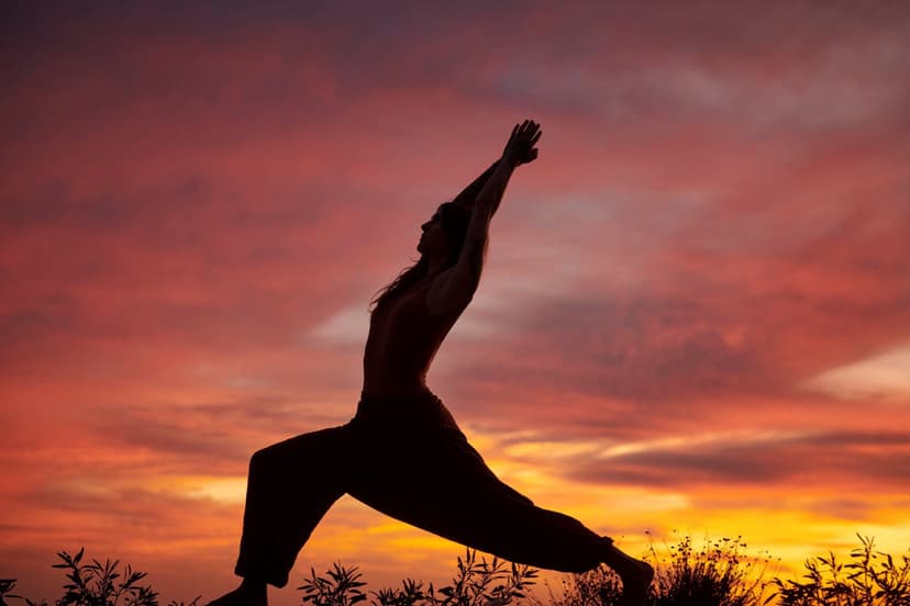person doing yoga outdoor as sun sets
