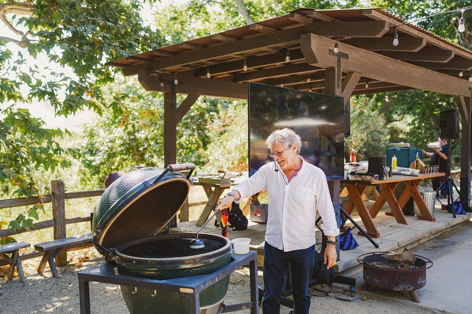 person cleaning grill