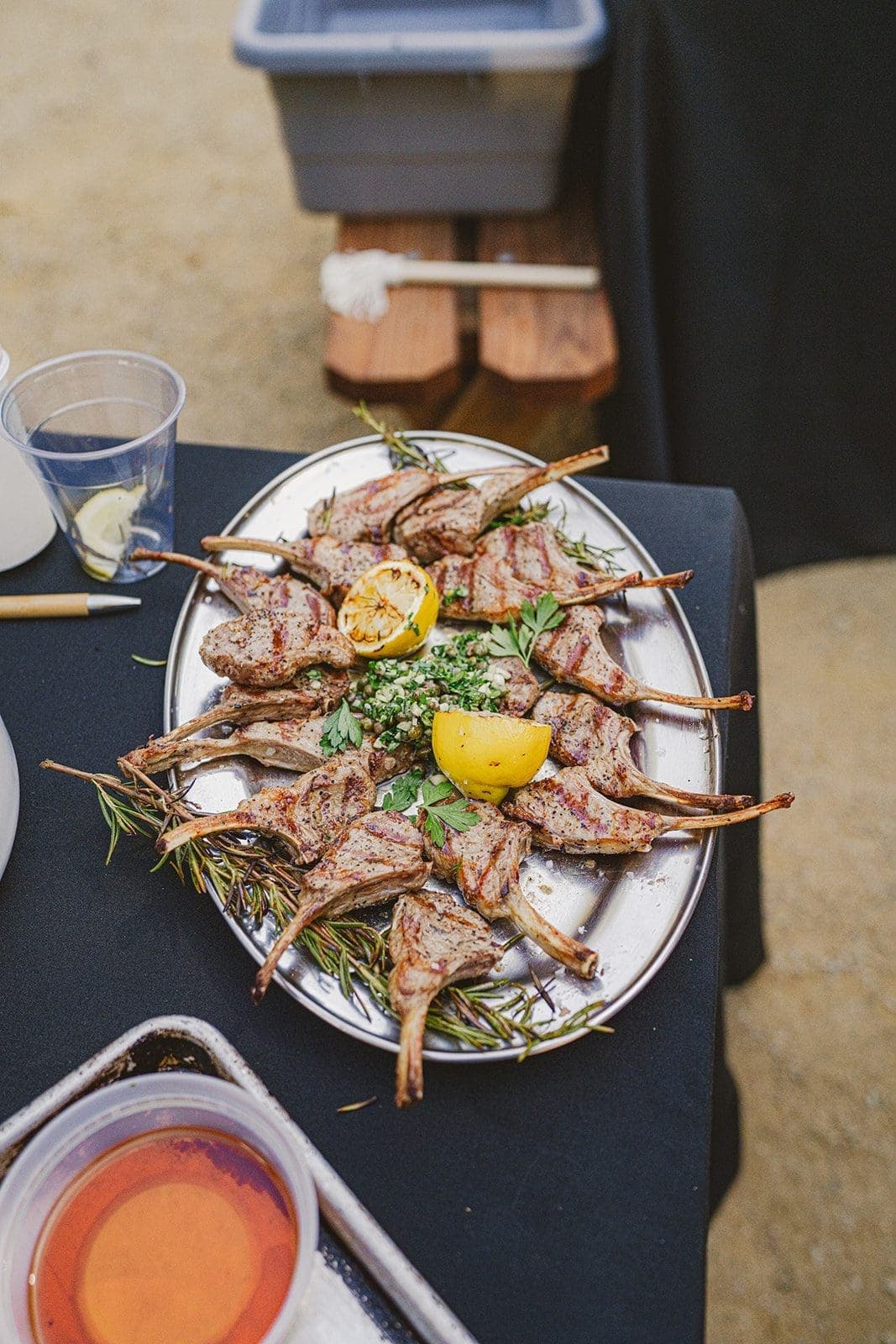 bbq lamb chops on plate with lemon and rosemary