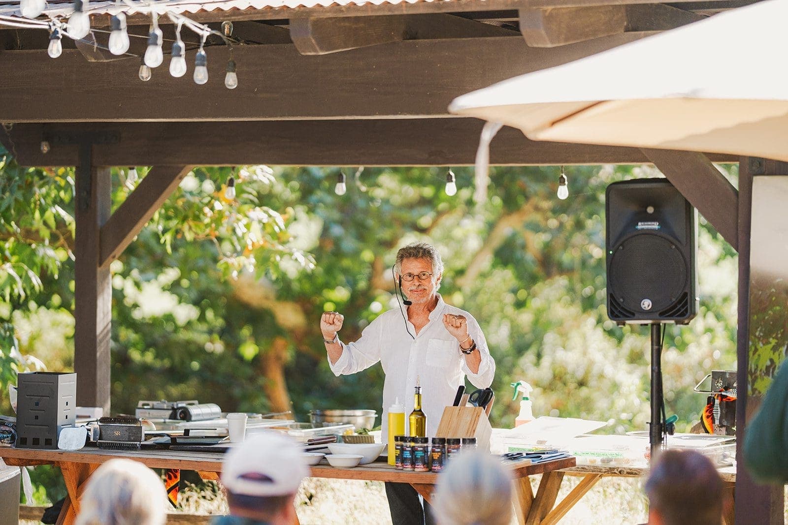man doing cooking demonstration infront of people