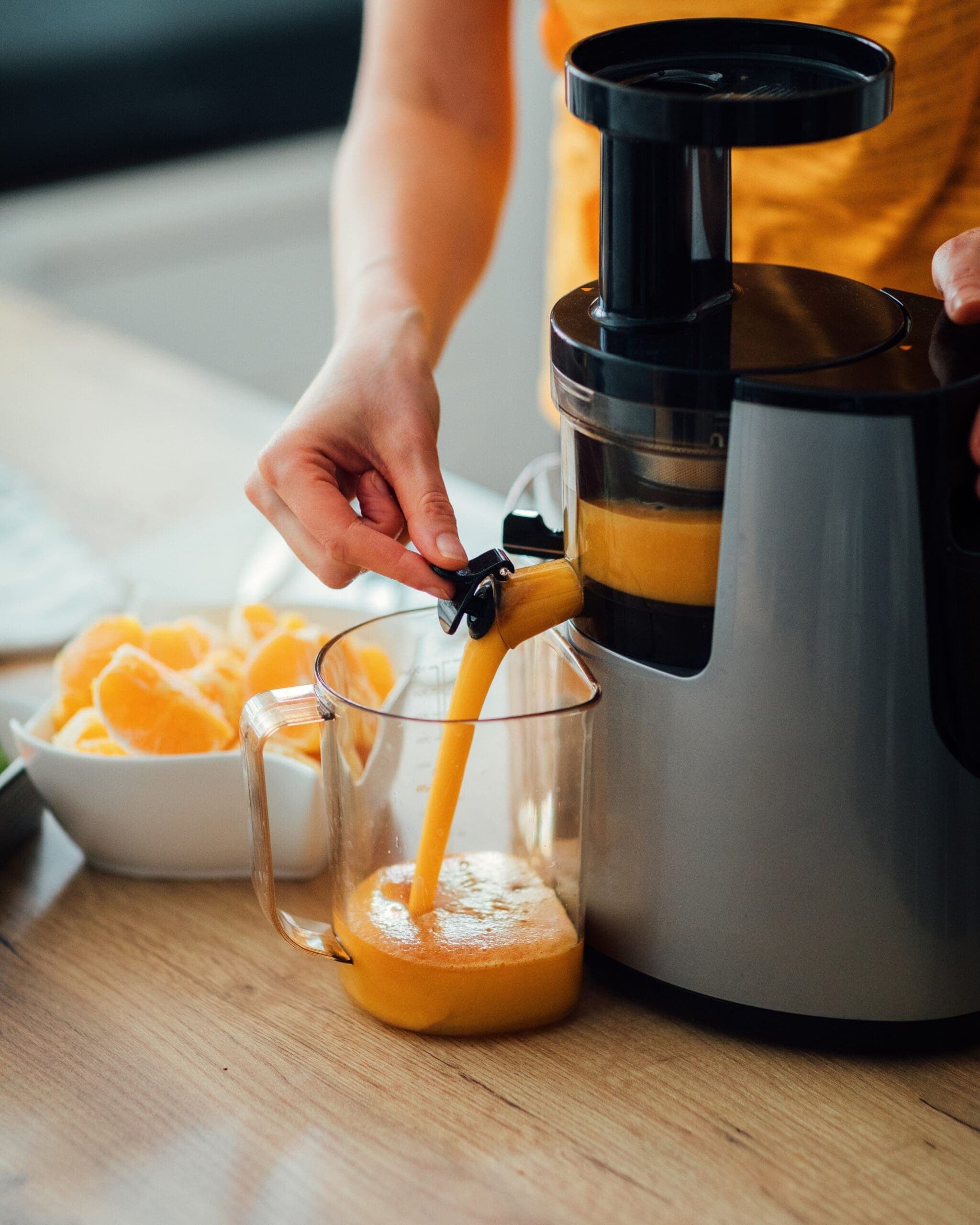 fresh orange juice coming out of machine