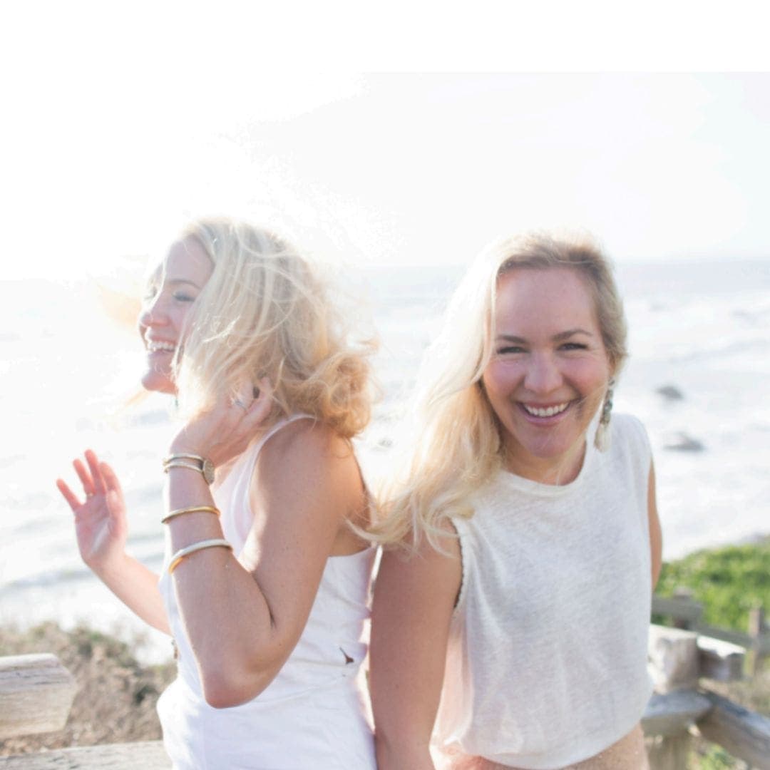 two friends smiling and laughing