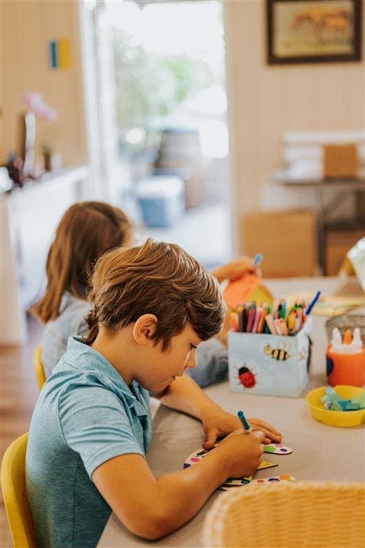 two kids doing crafts