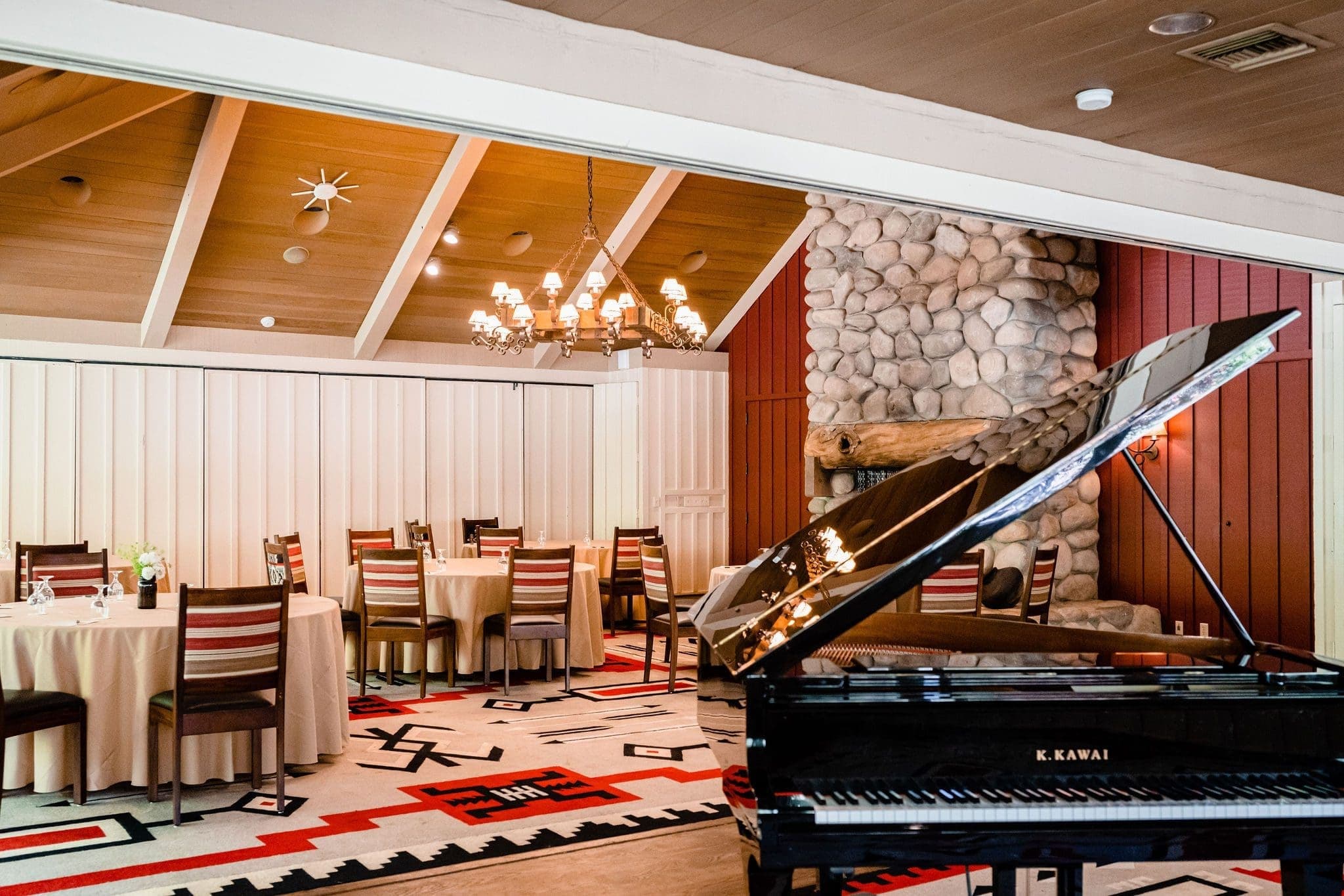grand piano by dining tables
