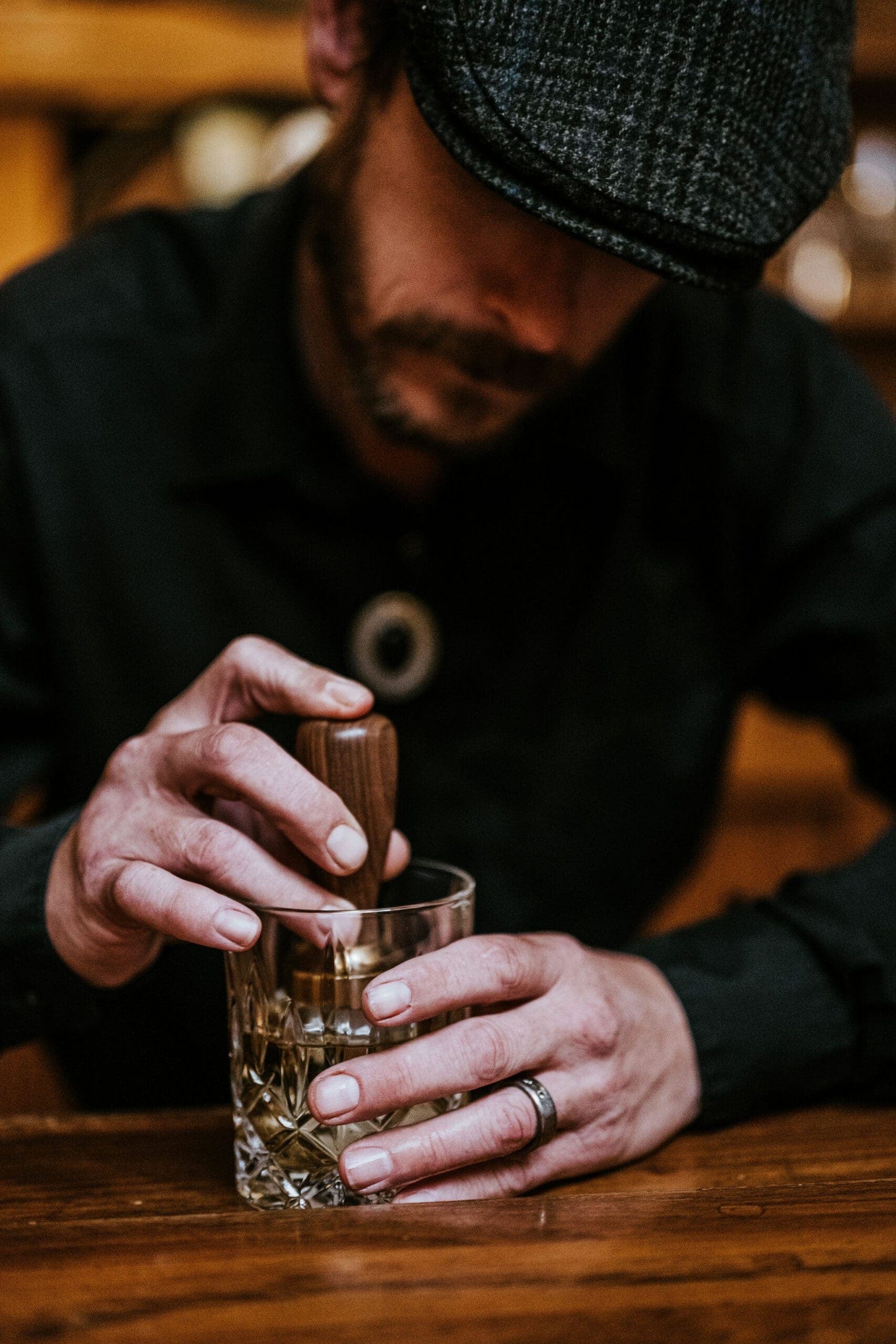 person making a drink in a glass