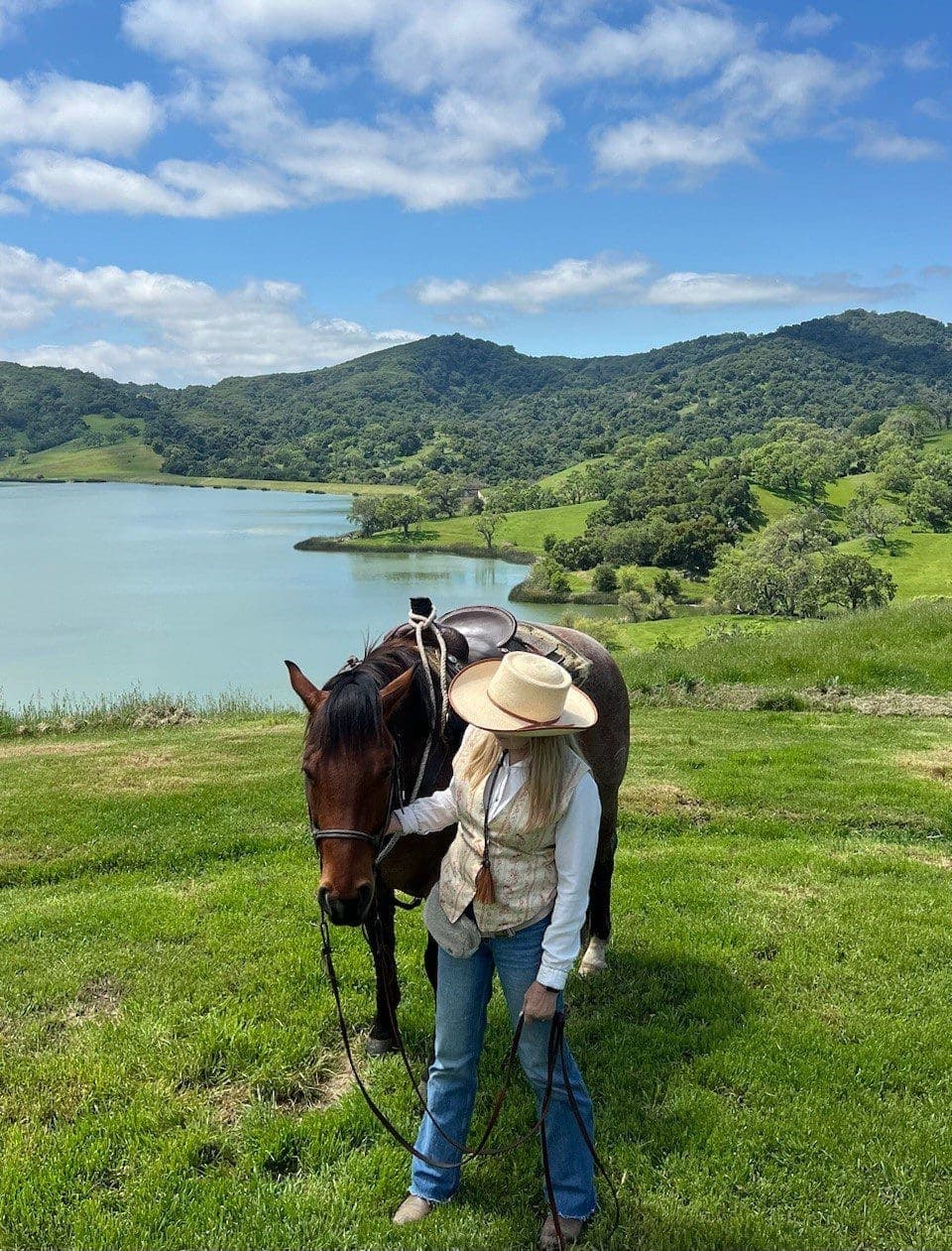 Janet Solie standing beside a horse