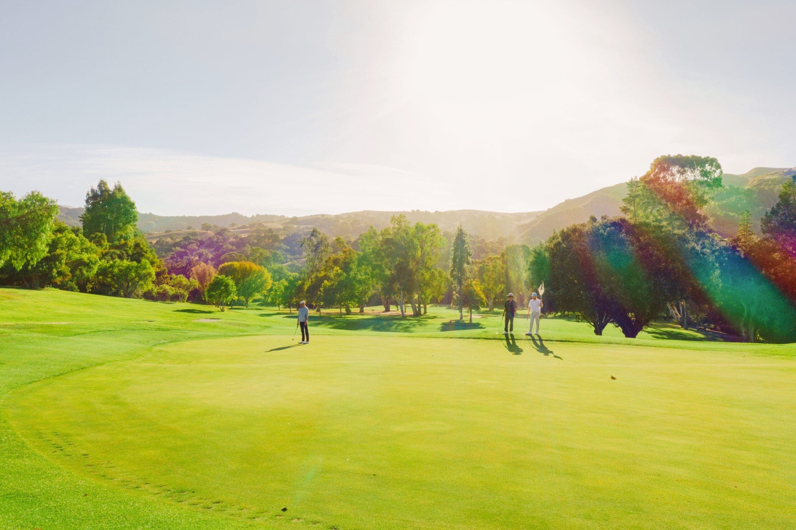 people golfing outdoors