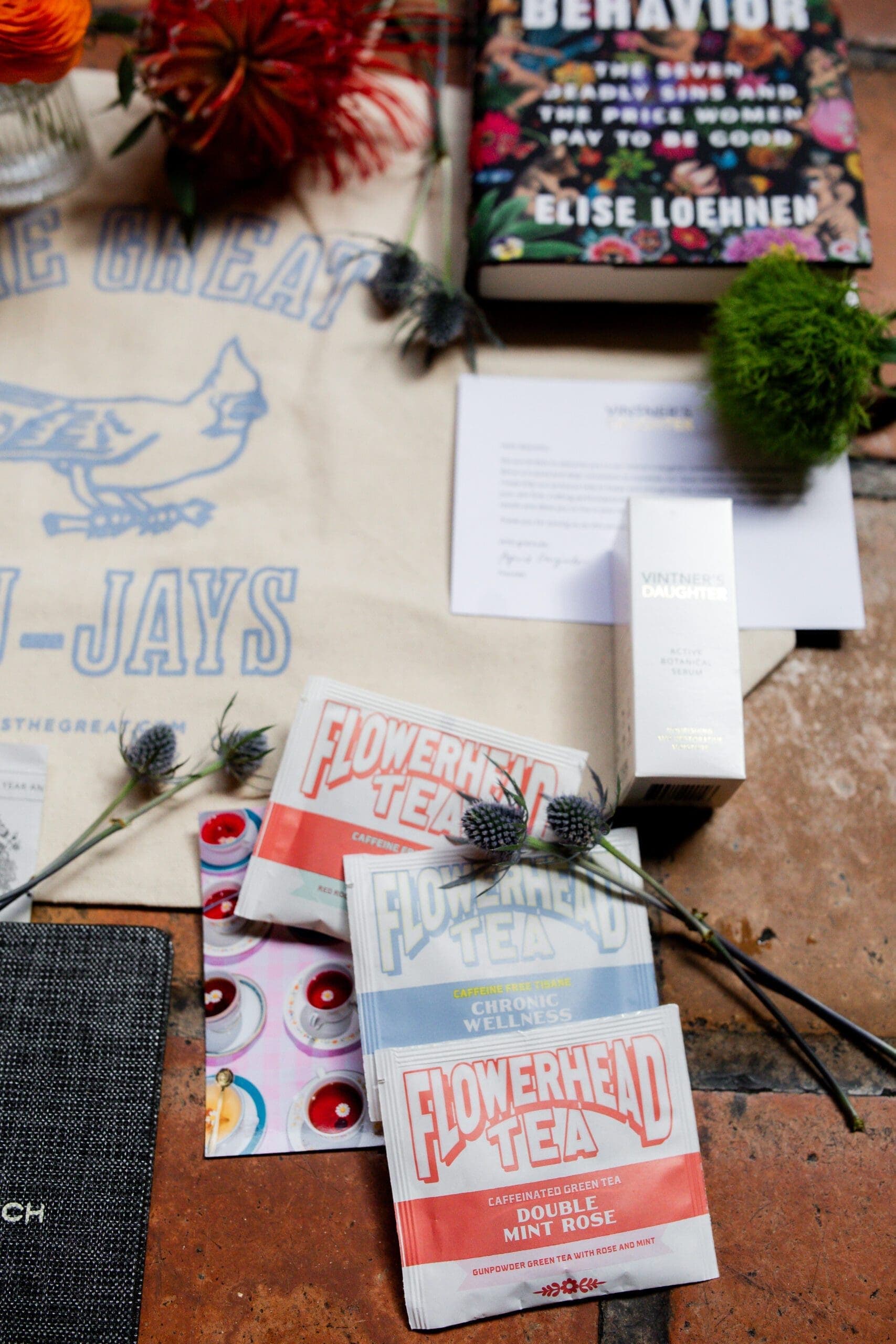 flower head tea bags, book and flowers