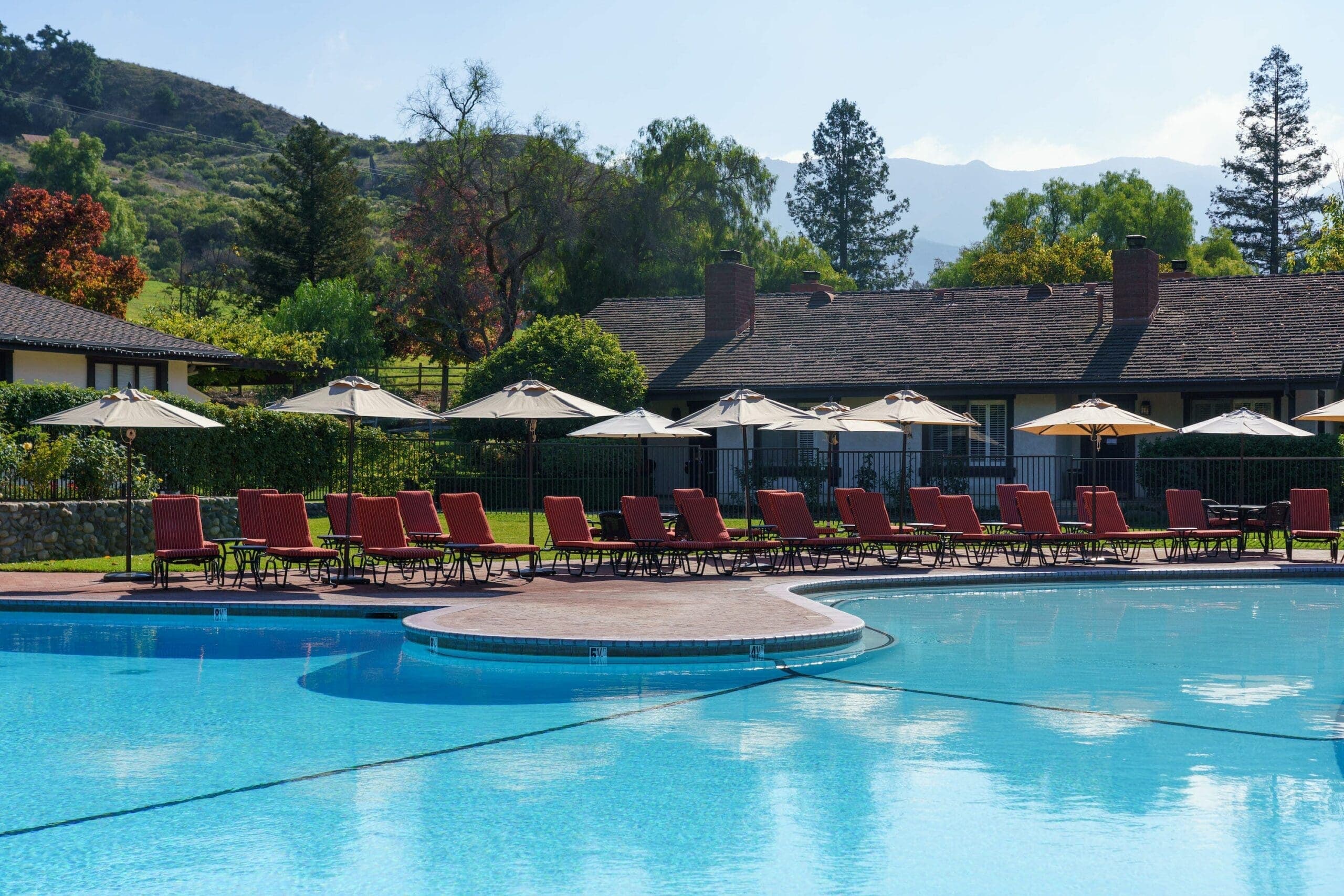 view of outdoor pool and lounge chairs