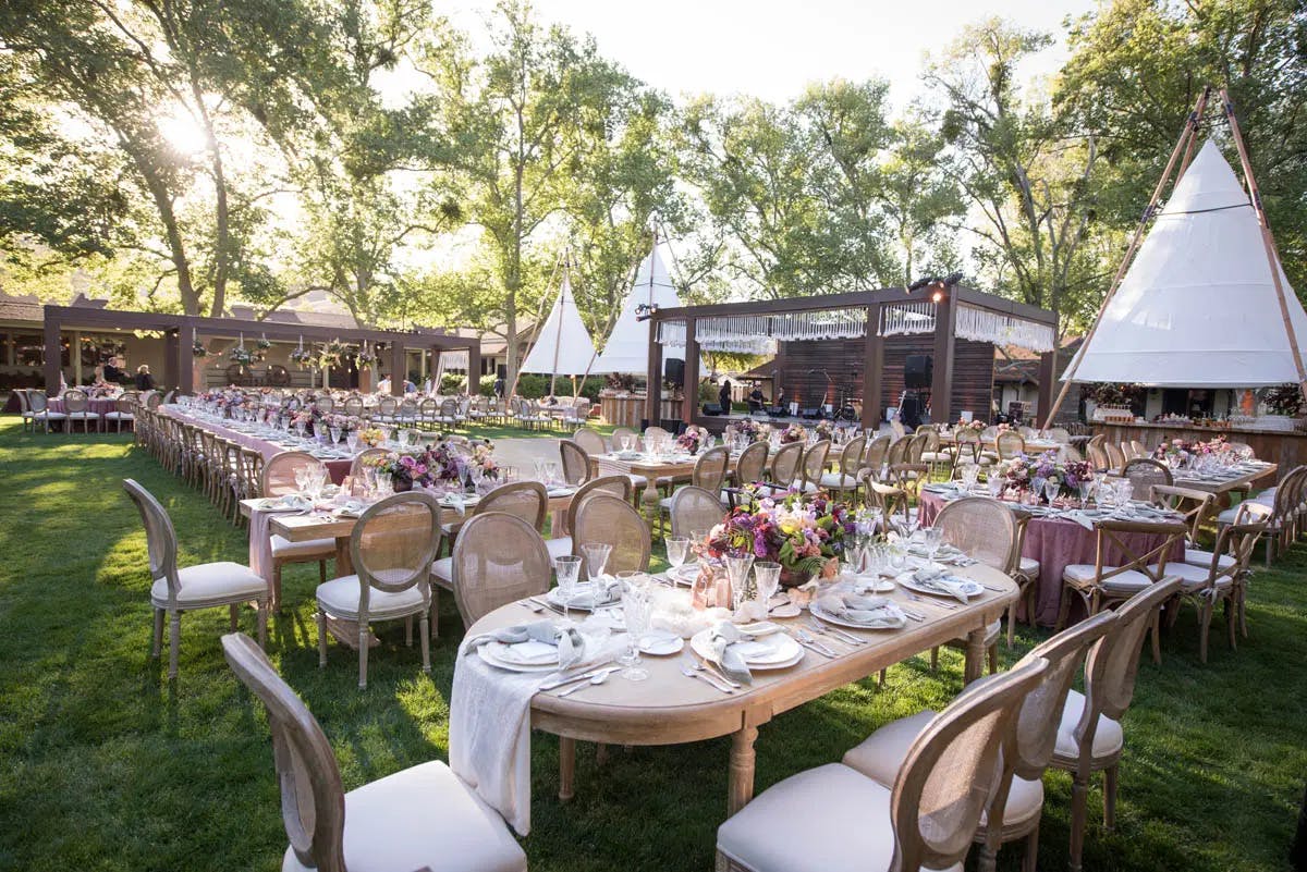 Outdoor wedding reception in the grassy oval at the Alisal Guest Ranch & Resort