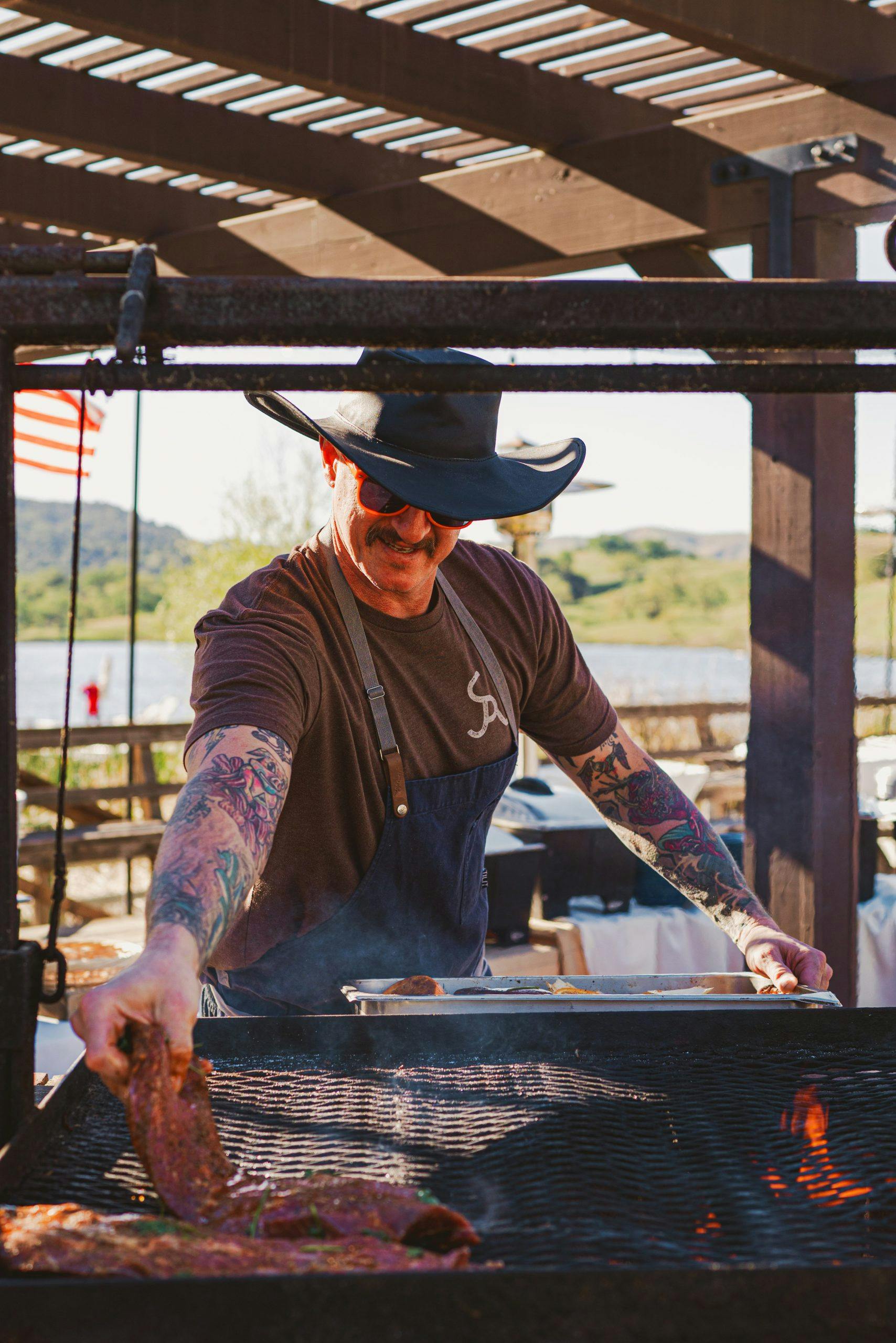 Alisal Ranch chef grilling beef