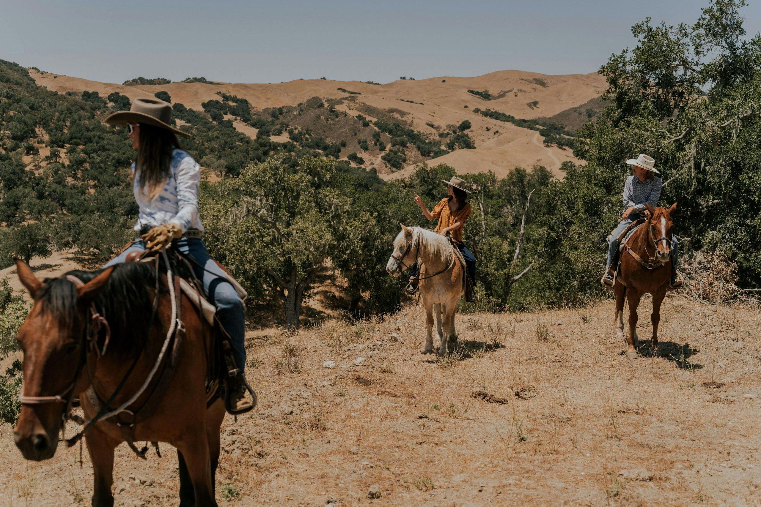A group horseback riding at the ranch