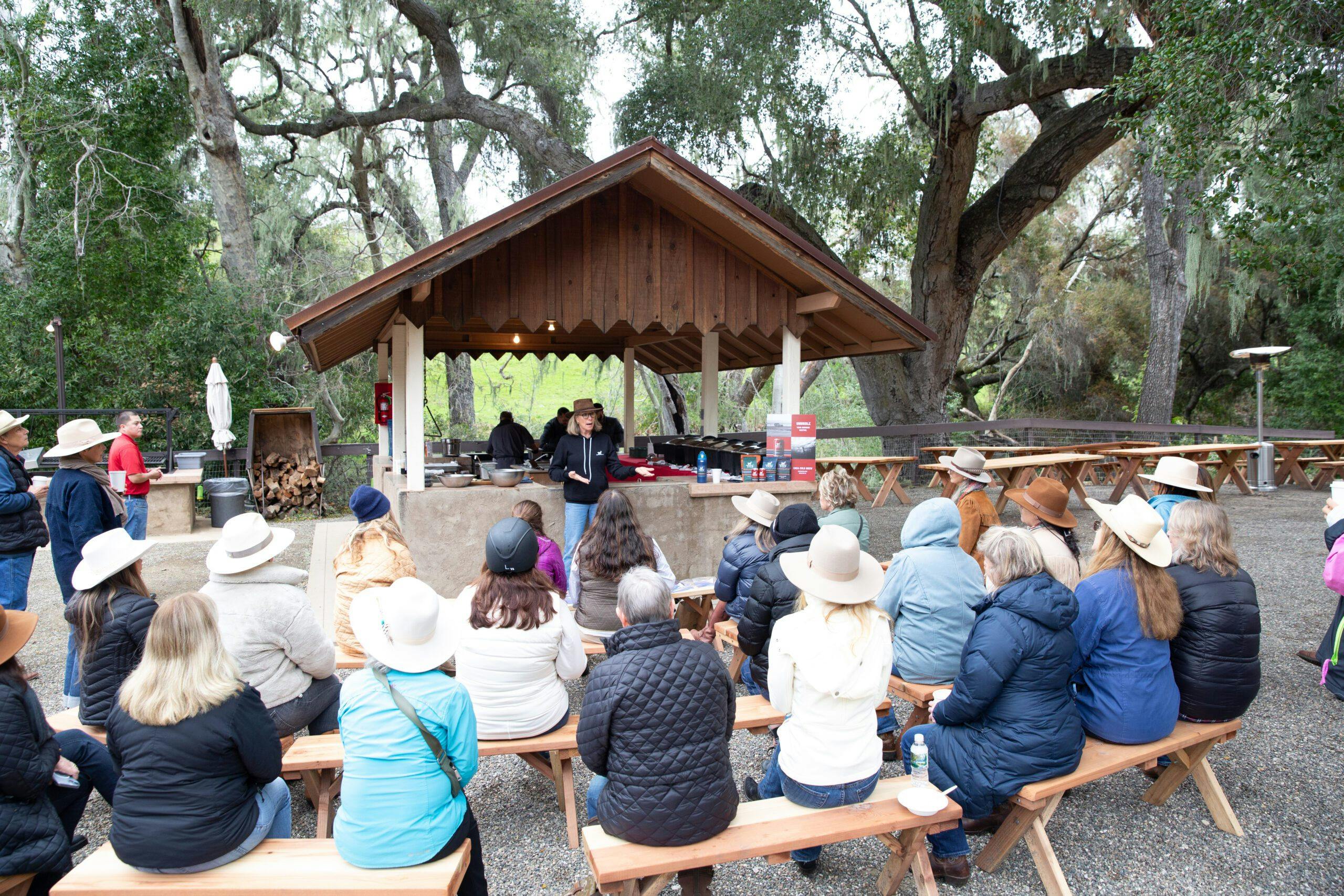 group of women sitting listening to a woman speak at the wildwonder fall women's retreat