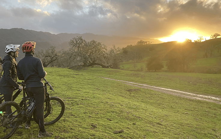 E-bike riders watching sunset