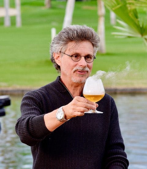 Steven Raichlen holding a glass