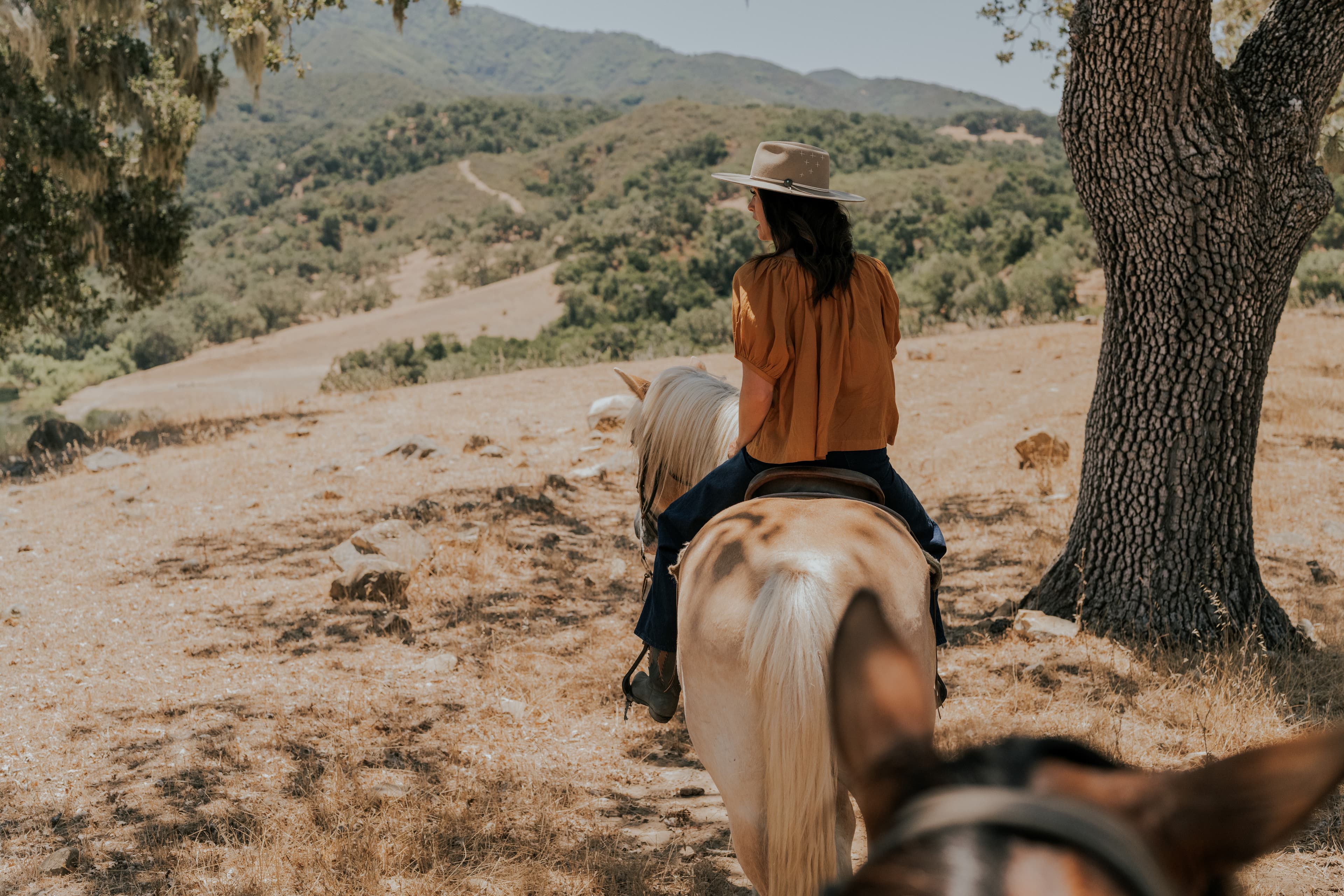 Rider view of woman riding horse at Alisal Ranch