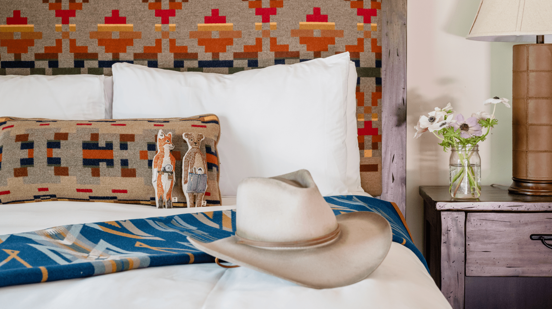 cowboy hat on bed of Jackson House room