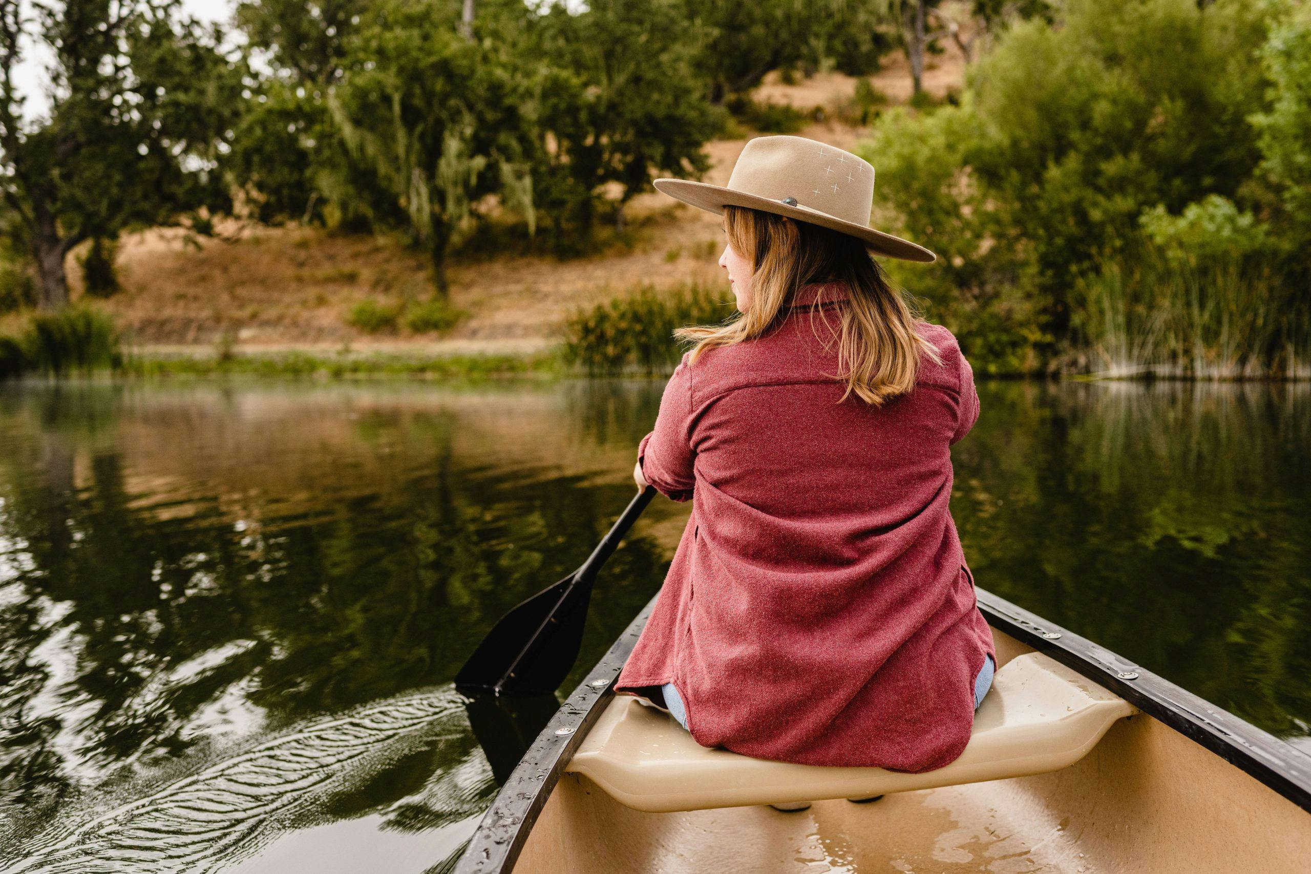 person canoeing on Alisal lake