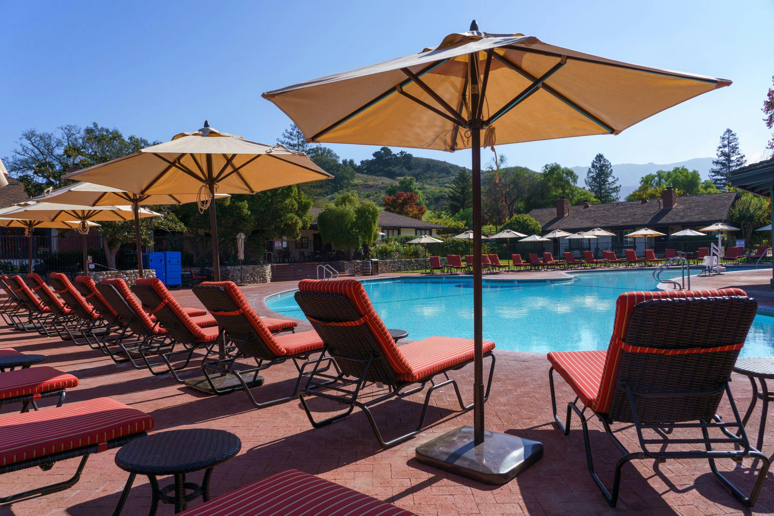 view of outdoor pool and lounge chairs
