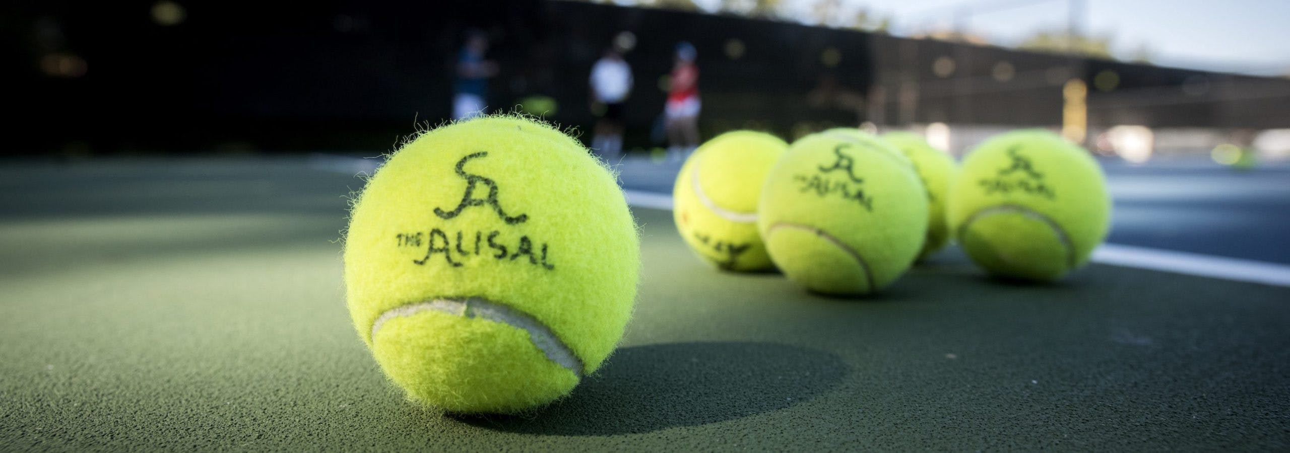 Tennis balls with Alisal logo